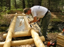 Shaping logs for decking.