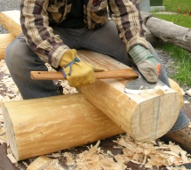 Planing timbers with an axe.