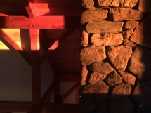 Sun on stone and timber. View from inside the office. Sun on stone and timber. View from inside the office.